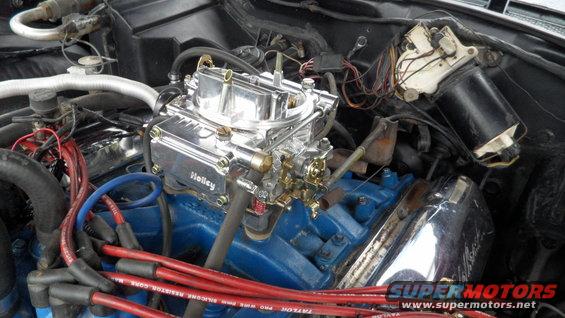 Engine bay with chrome Holley carburetor and blue engine block