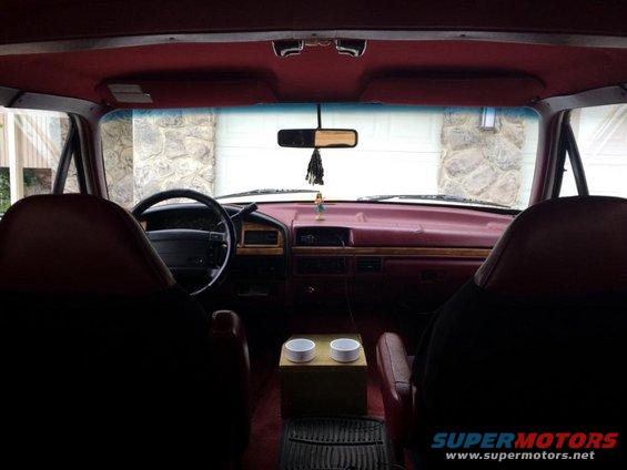 1995 Ford Bronco interior showing dashboard, steering wheel, and seats