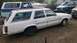1980 Ford Fairmont - A white 1980 Ford Fairmont station wagon is parked outdoors with other vehicles visible.