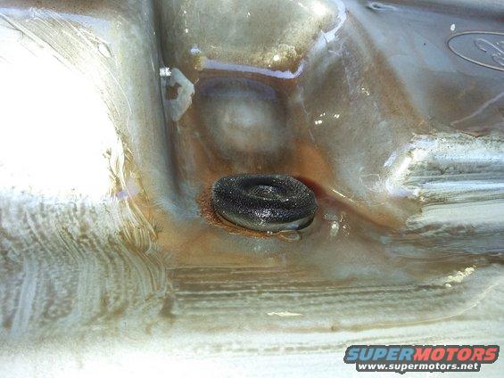 Ford emblem on a dirty, wet surface