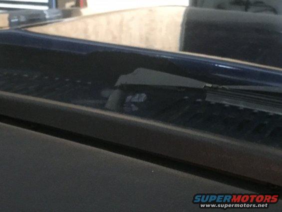 Close-up of windshield wiper and cowl area