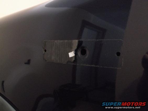 Removed emblem area on dark 2005 Ford F-150 fender