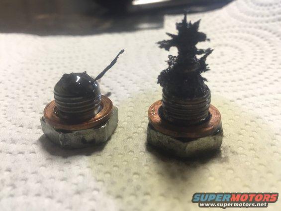 Two oil drain plugs with metal shavings, one with a wire fragment