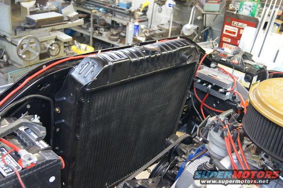 Radiator and engine bay with visible SuperMotors logo