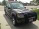 2005 Ford Sport Trac - This Ford Sport Trac is parked in a driveway on a sunny day. The vehicle has a custom hood scoop and a front bull bar.