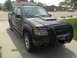 2005 Ford Sport Trac - This dark gray Ford Sport Trac is equipped with a black bull bar and a hood scoop.