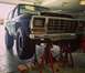 1979 Ford Bronco - This 1979 Ford Bronco is raised on jack stands for maintenance in a garage.
