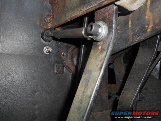 Close-up of vehicle steering linkage with rod and ball joint