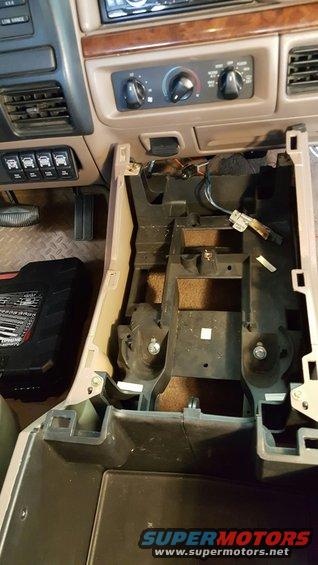 Center console of a 1992 Ford F-Series truck with trim removed, showing wiring and mounting points