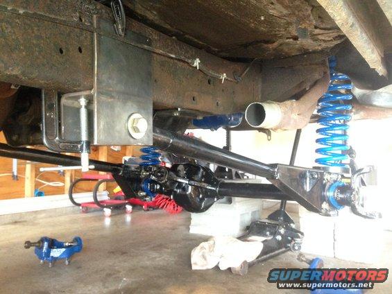 Vehicle frame with new blue suspension components and black differential