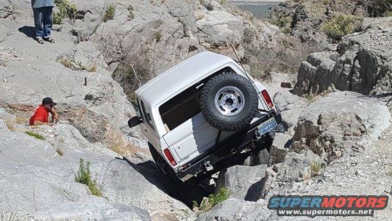 1979 Ford Bronco tilted on rocks during off-road trail