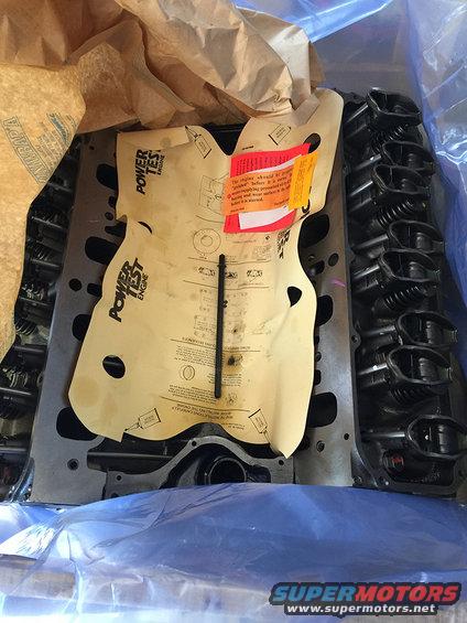 Engine cylinder head with "Power Test Engine" instructions