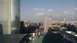 1971 Ford Ranchero - A panoramic view of a bustling city skyline tall buildings and infrastructure under a bright, cloudy sky.