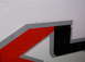 2011 Ford F-250 - Close-up of a graphic decal on the side of a white truck.