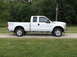 2011 Ford F-250 - Side view of a white 2011 Ford F-250 Super Duty pickup truck.