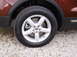 2016 Ford Explorer - Close-up of the front wheel assembly on a 2016 Ford Explorer, a silver 5-spoke alloy rim and a Michelin tire.
