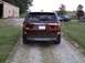 2016 Ford Explorer - Rear view of a maroon 2016 Ford Explorer parked on a gravel driveway with a barn in the background.