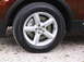 2016 Ford Explorer - Front wheel and tire assembly on a 2016 Ford Explorer. The alloy wheel features a five-spoke design with the Ford emblem.