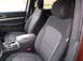 2016 Ford Explorer - Interior view of car seats and center console with a CD on the armrest. The registry label may be incorrect.