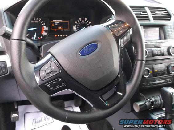 Interior view of 2016 Ford Explorer with dashboard and steering wheel