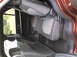 2016 Ford Explorer - The interior of the vehicle shows the rear seating area with fabric upholstery and dark trim.