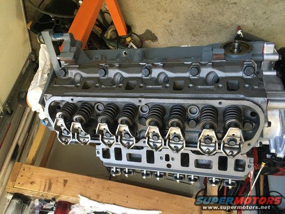 Engine block with valve train components visible, on an engine stand