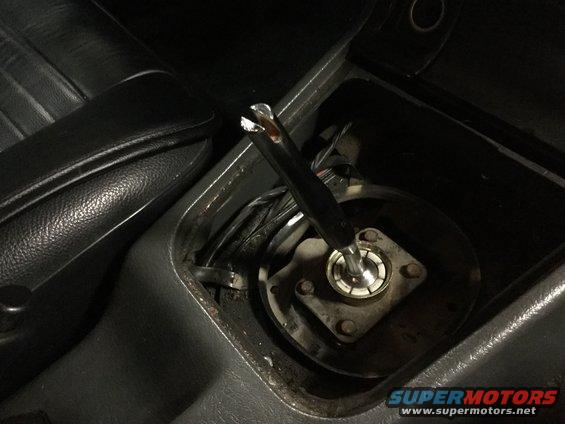 Gear shifter mechanism inside a car's center console