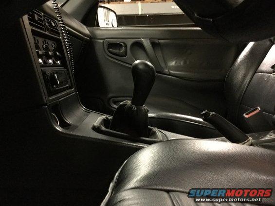 Interior view of black leather seats and gear shifter