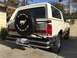 1990 Ford Bronco - Rear view of a 1990 Ford Bronco, showing the spare tire and California license plate.