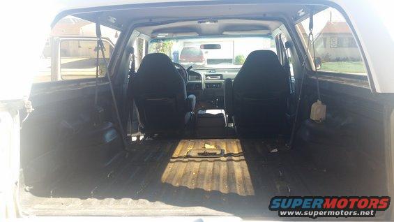 Interior view of a 1992 Ford Bronco showing front seats and cargo area