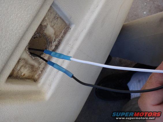 Close-up of electrical wiring and conduit, possibly in a vehicle's interior