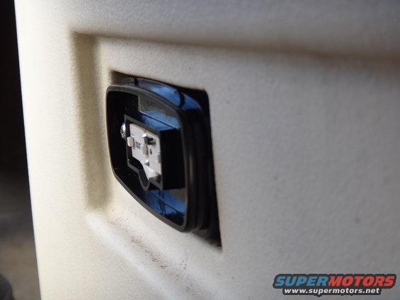 Close-up of a sticker on a vehicle's exterior