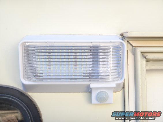White exterior RV light with motion sensor and LED array