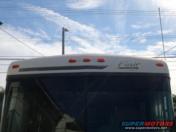 RV roof with amber marker lights and 'Flair' badging on the front