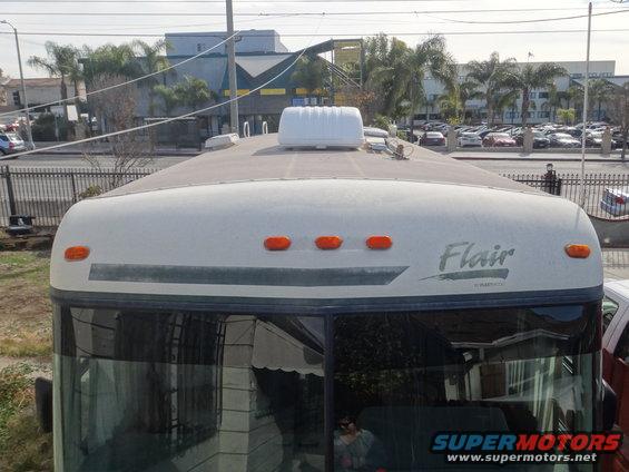 RV roof showing vents, marker lights, and 'Flair' badging
