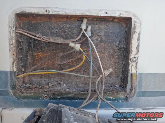 Exposed wiring and connectors in a recessed, dirty compartment