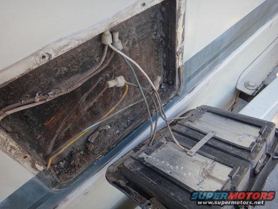 Exposed vehicle wiring and a removed electrical component