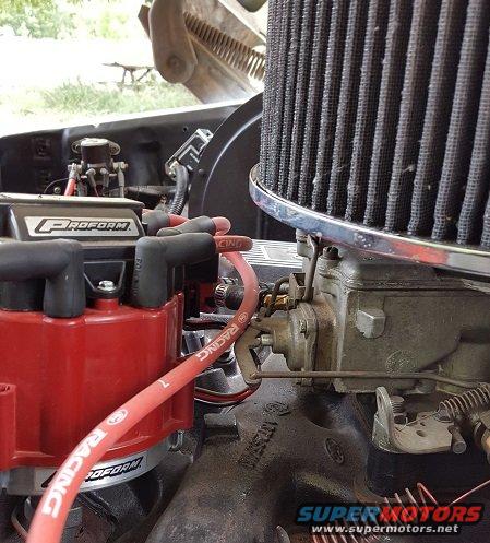 Engine bay with red Proform distributor cap and chrome air filter