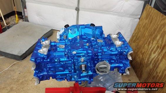 Blue engine block on red stand