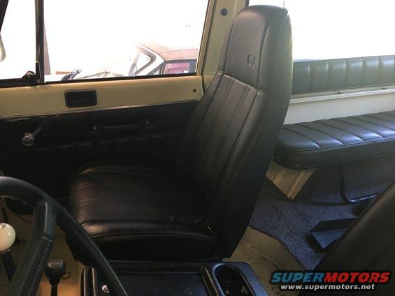 Black leather seats and interior door panel of a vehicle