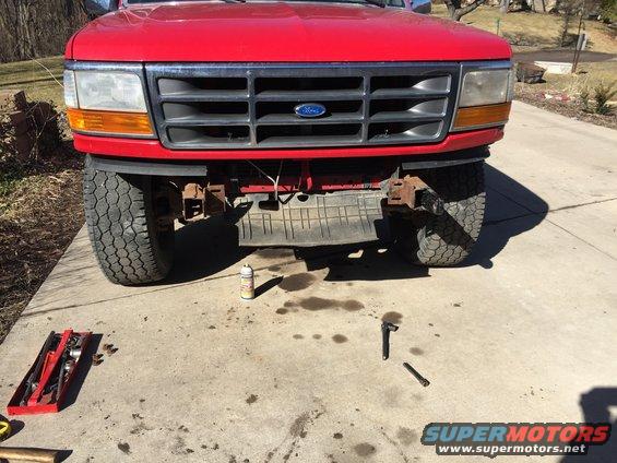Red 1996 Ford F-150 front end with grille and headlights visible