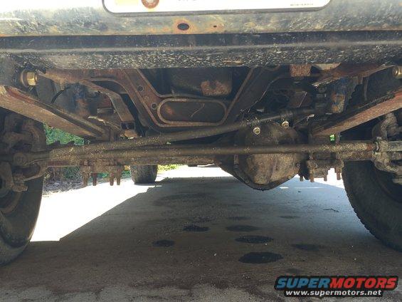Underside view of a 1996 Ford F-150 showing front axle and suspension components