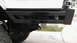 1979 Ford Bronco - Close-up view of the rear bumper and suspension of a vehicle.