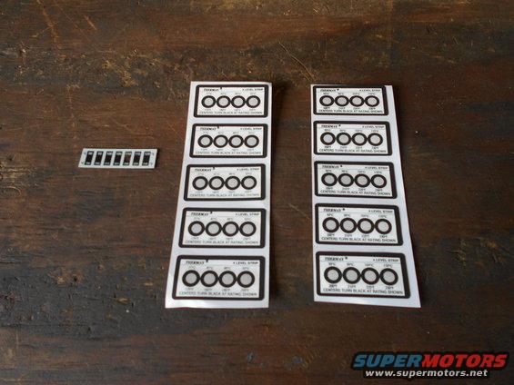 Sheet of gauge cluster decals with multiple circles and text, plus a separate strip of smaller decals