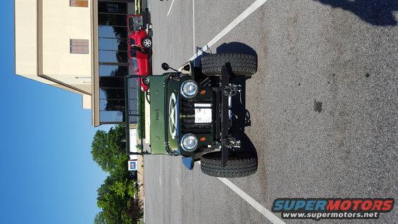Green 1948 Jeep Wrangler front view with star emblem on hood