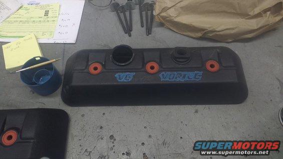 Black V6 Vortec engine cover with orange accents