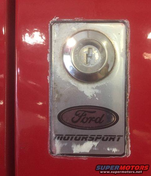Red door with Ford Motorsport badge and keyhole