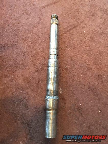 Metal shaft with a threaded end and a welded section