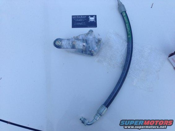 Power steering hose and bracket assembly