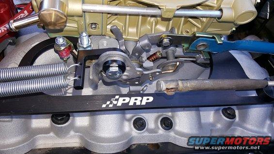 Close-up of PRP carburetor linkage with dual springs